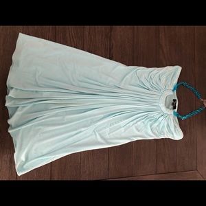 Light blue/turquoise in color dress